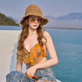 Chapeau de paille tissé ajouré et découpé pour la plage et le soleil